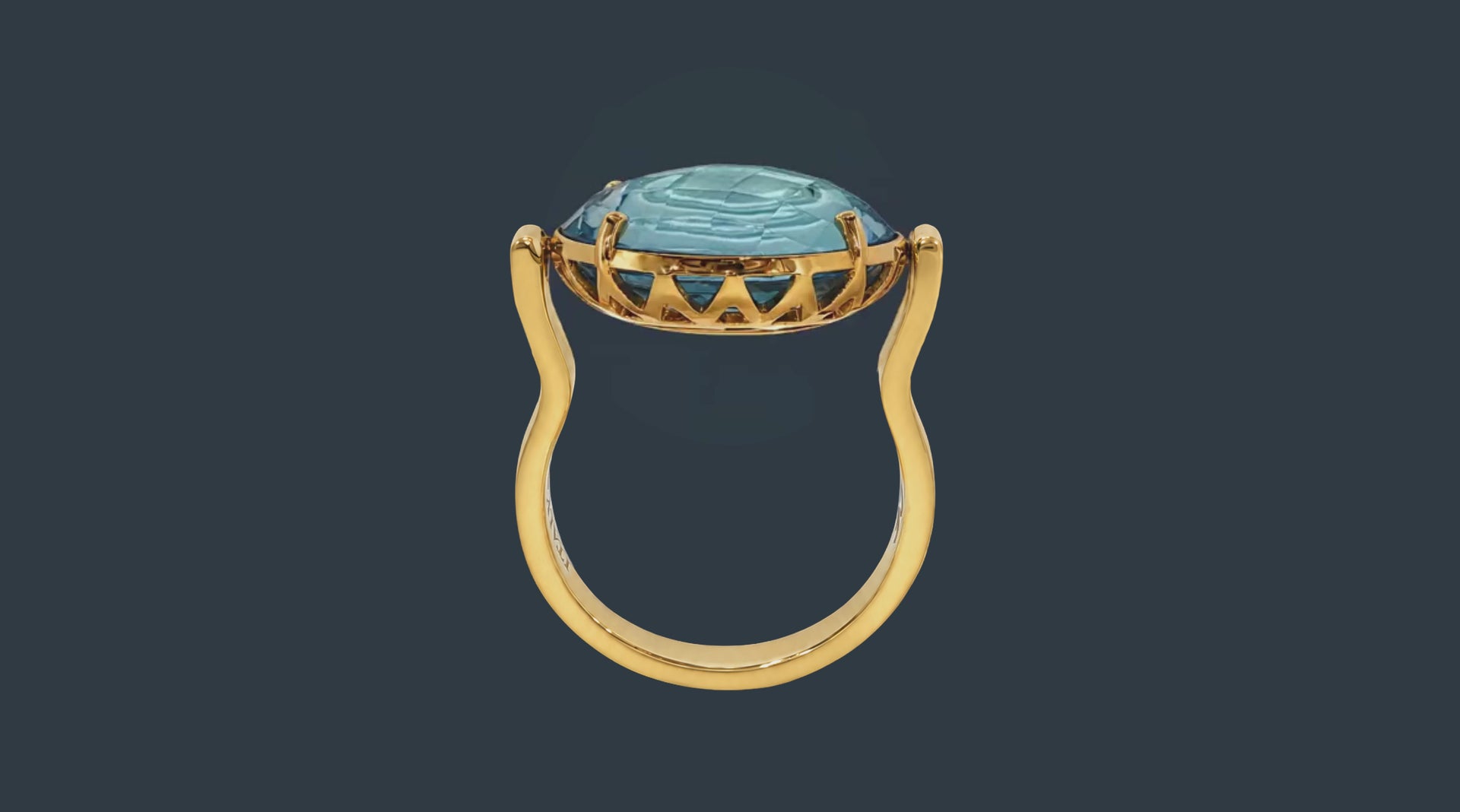 Colette Falchet DuoUno Chakra Collection, Throat Chakra reversible signet ring in 18k yellow gold. Its light blue topaz top swivels, offering two ways to wear it: the gemstone face or the Throat Chakra seal face.